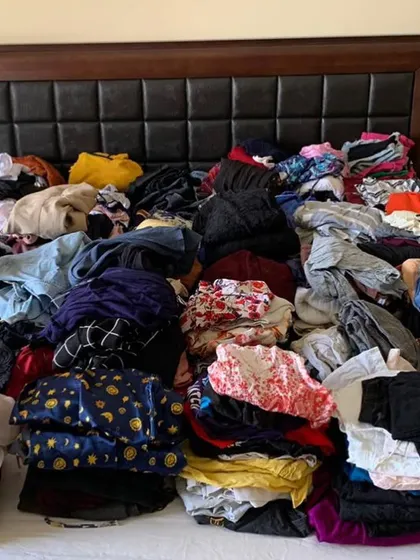 This is what a closet can look like before we start the decluttering process. It's overwhelming and makes it hard to see what you actually have.