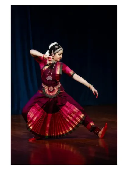 A dynamic pose from a rhythmic sequence, with the body in a strong diagonal line.