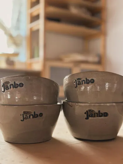 A stack of our custom bowls, showing the beautiful, earthy glaze.