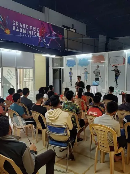 A view from the back of a nutrition session, showing the group of dedicated athletes learning about hydration. We believe that knowledge about their bodies is a powerful tool for every player.