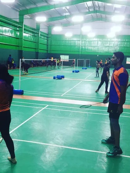 A player waits in ready position for the next serve. I provide the ideal environment for your team to immerse themselves in the sport and enjoy a day of active fun.