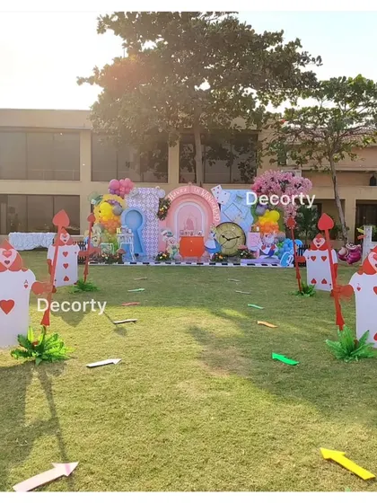 A wide shot showing the scale of the outdoor Alice in Wonderland setup.