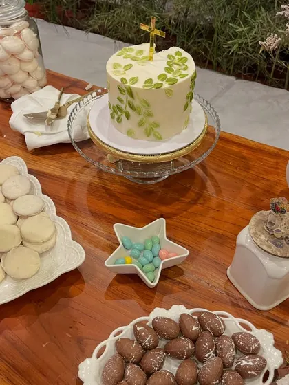 Another view of the Holy Communion and Baptism cake on the beautiful dessert table at Evolve Back, Coorg. The simple green leaf design was elegant and fit the natural surroundings perfectly.