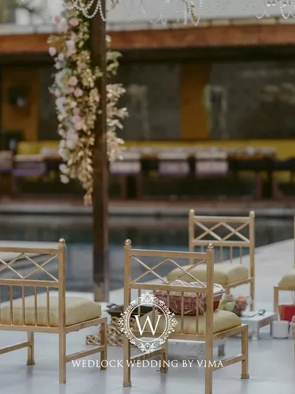 For this Punjabi wedding, we designed a subtle and elegant poolside mandap. The decor featured light fabrics, soft peachy-pink florals, and hints of gold to complement the serene setting.