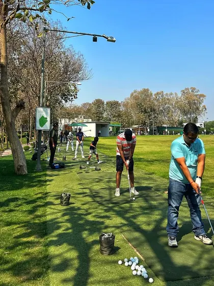 Golfers enjoying a sunny Saturday on the range, the only way we know how to spend a weekend.