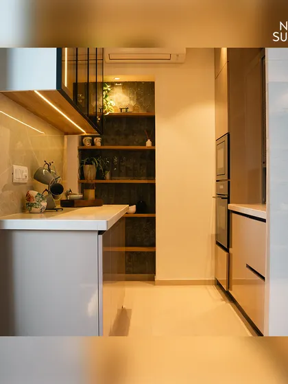 This shot shows the full height of the kitchen cabinetry, including integrated appliances. By expanding the original 80 sqft kitchen to 150 sqft, we created a far more functional and spacious room.
