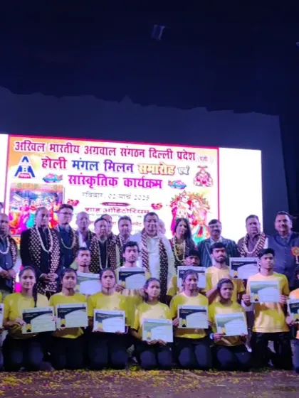 The entire team on stage receiving accolades after their fantastic performance. This recognition motivates us to continue striving for excellence.