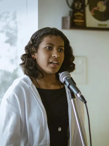 A proud moment from our student recital, capturing the emotion of a young vocalist.