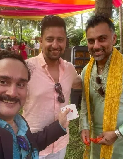 Taking a selfie with guests at a vibrant outdoor wedding event. My walkaround magic is a fantastic way to entertain guests during a sangeet or reception.