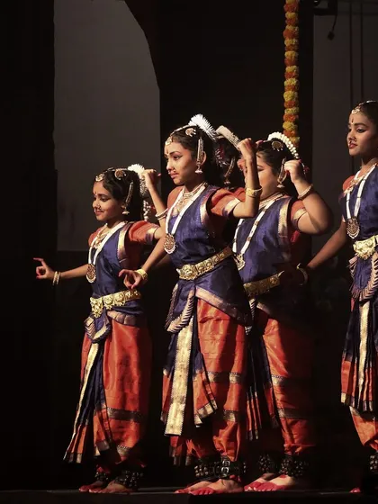 A synchronized pose by the junior dancers. Teaching them the foundations of Bharatanatyam is a responsibility I cherish.