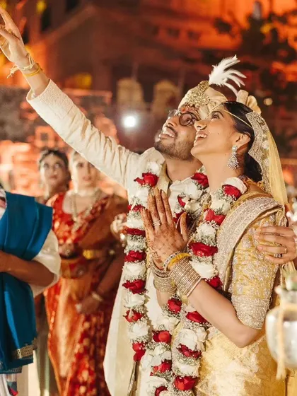 The couple looking towards the sky during the 'Saptapadi' ritual, a beautiful moment of shared hope and dreams.