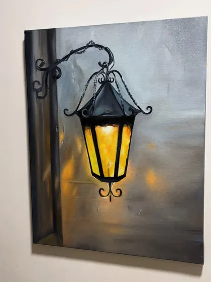 A painting of a vintage street lamp, glowing warmly against a simple wall. This piece captures a quiet, nostalgic mood.