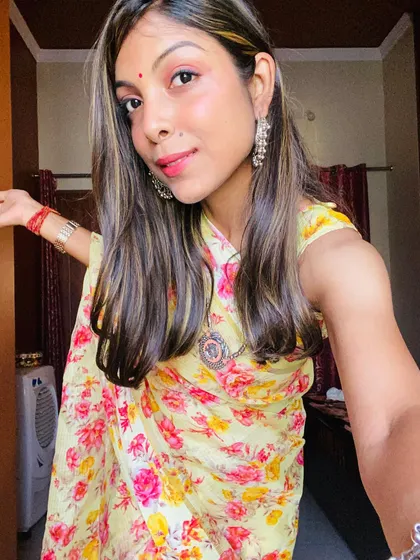 A happy, candid shot in my floral saree. Personal styling is about finding clothes that let your personality shine through.