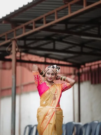 A full-length bridal portrait, capturing the bride's pose and the details of her beautiful wedding attire.