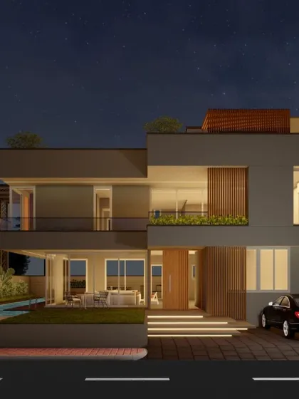 A night view of the modern villa, showcasing the seamless transition from the illuminated interior to the outdoor spaces. The design ensures the home is just as impressive after sunset.