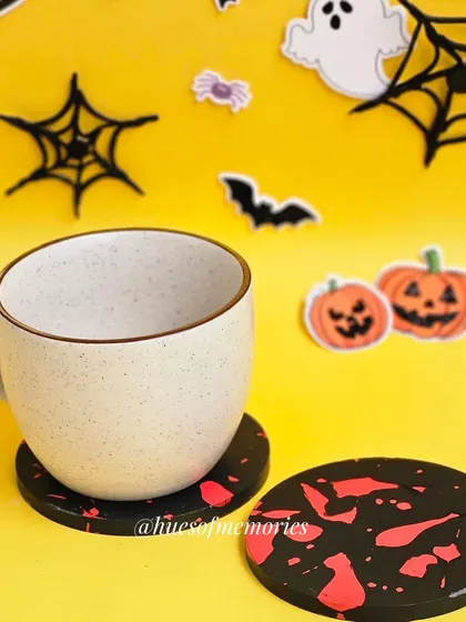 Here's one of the blood-splatter coasters in action, holding a coffee mug. They are a practical and fun addition to your seasonal decor.