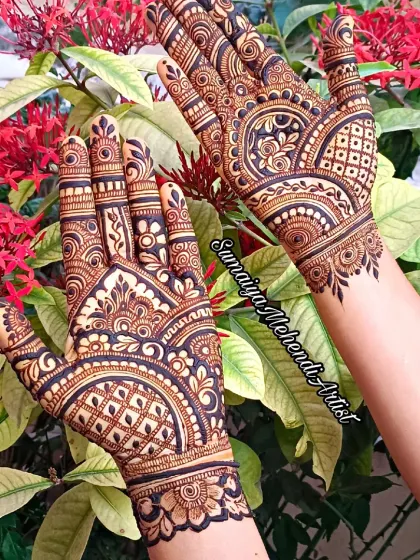A second shot of this beautiful, intricate design, showcasing the detailed work on both the front and back of the hands.