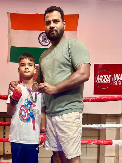 Me with our U-11 state bronze medalist, Devansh. Building a strong foundation from a young age is key to future success.