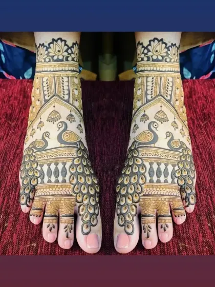 My artistry extends to beautiful foot mehndi. This design features majestic peacocks whose feathers flow down the feet, creating a stunning effect that complements any bridal or festive look.
