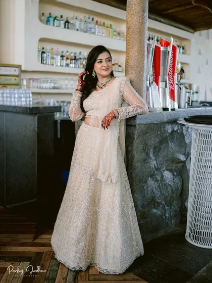 A stunning solo portrait of the bride-to-be, Swati, looking radiant in her white lehenga.