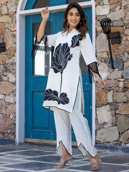 Here is a full view of my black and white floral cord set. This two-piece outfit includes a straight-fit kurta and matching pants, offering a modern and coordinated look that stands out from traditional ethnic wear.
