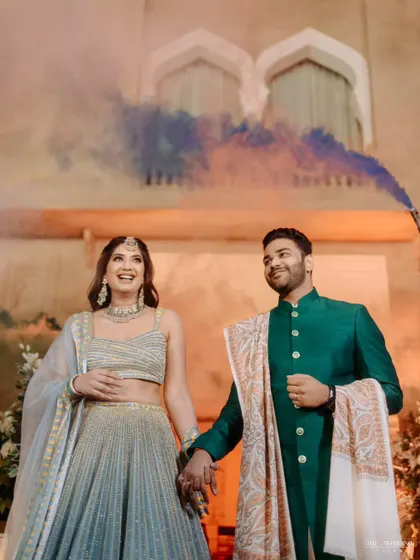 The couple's grand entrance with color smoke bombs, adding a touch of drama and excitement to their Mehendi celebration.