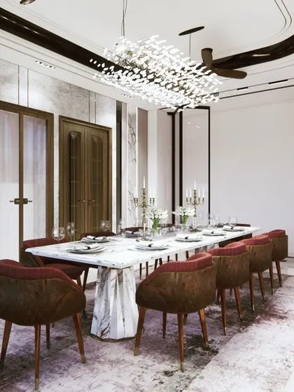 Another perspective of the grand dining room, highlighting the textured marble wall and a unique ceiling design with a crystal chandelier. The layout is designed for large gatherings, balancing luxury with comfort.