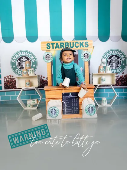 Too cute to latte go! This unique Starbucks-themed shoot features a tiny barista in his own coffee stand, serving up smiles and charm. It's a fun and modern theme for any coffee-loving family.
