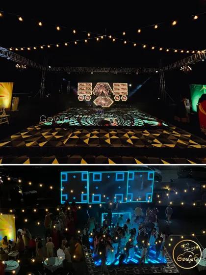 The Sangeet stage and dance floor setup, featuring a large LED wall and overhead lighting.