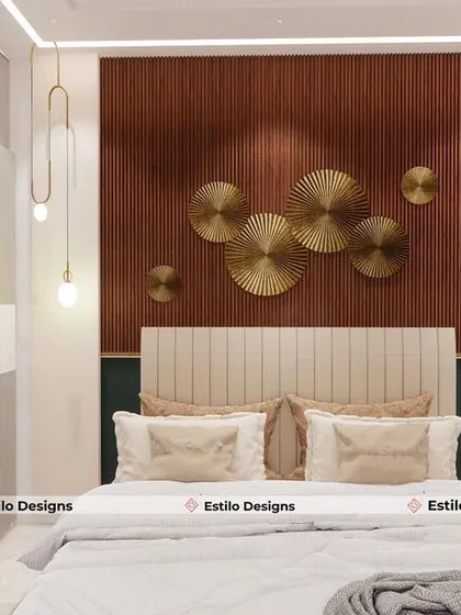 In this bedroom, I created a feature wall using a rich wood-tone panel and striking metallic art pieces. The pendant lights add a touch of modern elegance, while the neutral color palette keeps the space feeling calm and balanced.