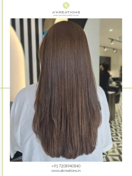 Effortless chic in a single photo. This client's hair was transformed with a beautiful, natural-looking brown color and a healthy, straight finish.