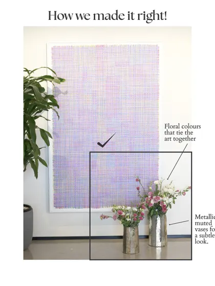 And here is how we made it right. By choosing muted metallic vases and selecting floral colors that tie into the artwork, the entire setup feels harmonious and intentional. This simple switch creates a much more sophisticated and balanced look.
