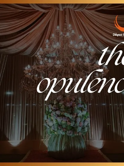 The opulence of our decor is designed to create a sense of grandeur. This close-up of a magnificent crystal chandelier and floral arrangement showcases the luxury we bring to every event.