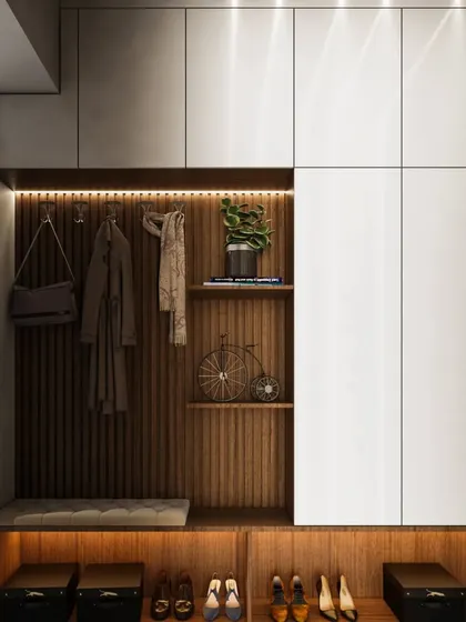 This highly functional mudroom-style foyer has everything you need: a bench for sitting, hooks for bags and coats, and ample shoe storage.