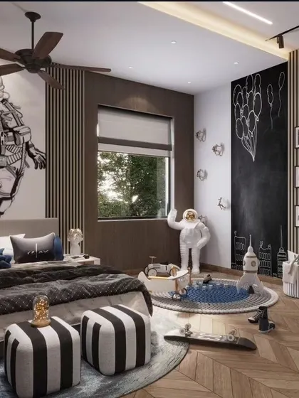 We believe a child's room should be a universe of imagination. This space-themed bedroom features a bold astronaut wall mural, a chalkboard for creativity, and playful details like a rocket ship and Minion figures, creating a fun and inspiring environment that grows with the child.