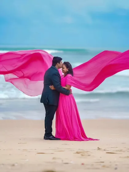 A romantic beach pre-wedding shoot. I provided this beautiful pink gown with a long, flowing trail that looks incredible against the ocean waves, along with full makeup and hair styling.