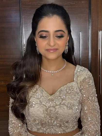 A close-up of the soft glam makeup for this cocktail look. The focus is on beautifully blended eyeshadow and a flawless base that glows under the lights.