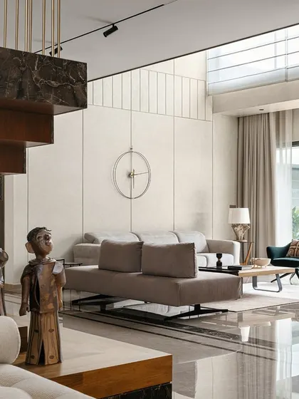 The central staircase in Villa Shakthi is more than just circulation; it's a sculptural intervention. It springs from a plinth of contrasting marble and transitions to wood and steel, connecting the ground floor with a bridge that overlooks the double-height family area.