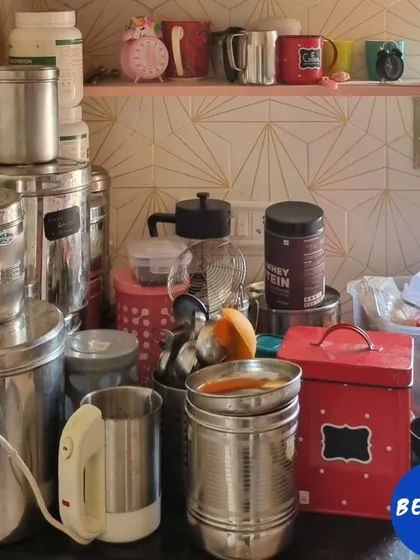 Before, this kitchen counter was cluttered and unusable. By using shelf risers to optimize vertical height, we created a clean, organized coffee and tea station.