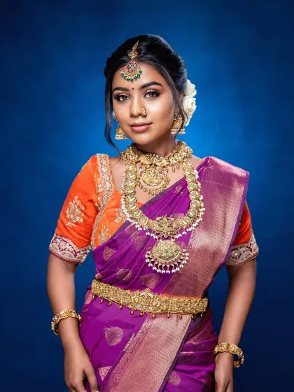 The full look shows how the vaddanam (waist belt) and bangles complete the traditional attire. It is all about creating a balanced and harmonious style.