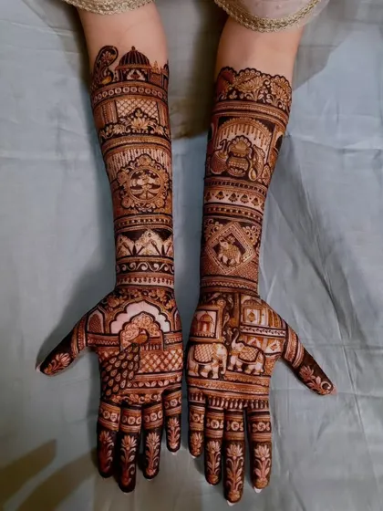 A traditional design filled with classic motifs like peacocks, elephants, and architectural domes.