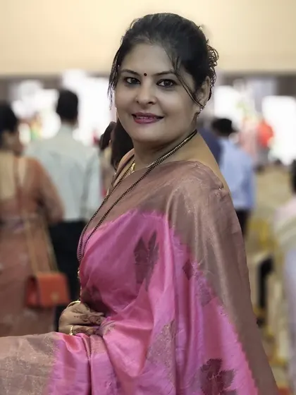 Another angle of the pink silk saree, showing its rich texture and sheen. This is a perfect example of classic occasion wear.
