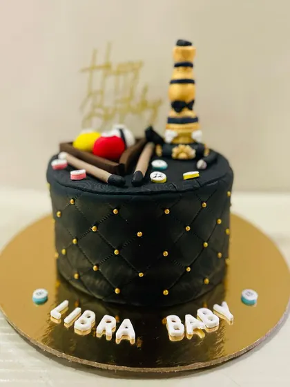 A wider shot of the unique hookah and pool themed cake.