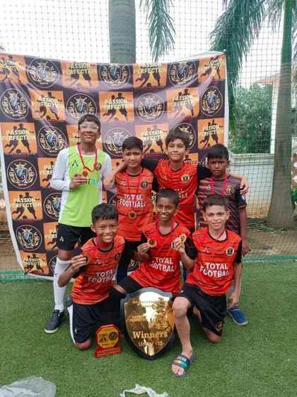 The U13 team celebrating their championship win at the 5v5 Sports Cup 3.0.
