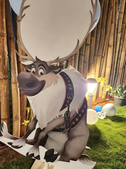 Life-sized character cutouts, like Sven from Frozen, make for great photo opportunities and help bring the party's theme to life.