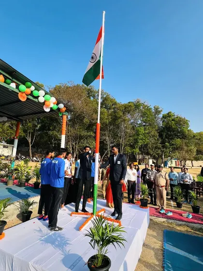 A full view of the stage during the flag hoisting. The presence of so many athletes and officials shows the importance of sports in our national identity.