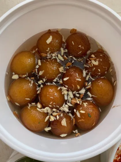 A bowl of delicious Gulab Jamoons.