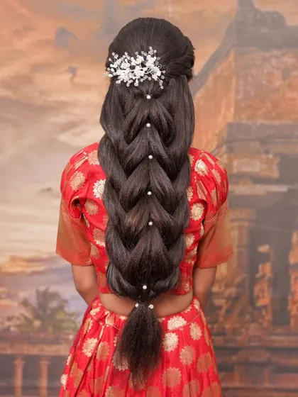 Another angle of this stunning, pearl-adorned braid. This type of advanced hairstyling is perfect for brides who want a memorable and photogenic look.