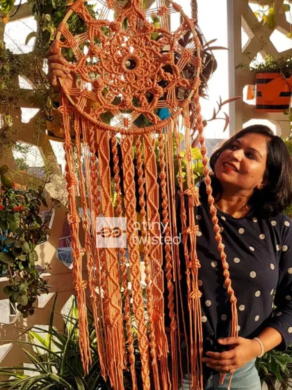 The beauty of a handmade dreamcatcher is in every single knot. This piece is 4 feet tall with a 16-inch diameter, designed to be a soothing and beautiful focal point.