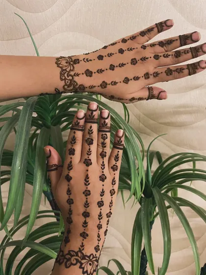 A delicate and pretty design with vertical lines of small flowers. This is a great choice for someone who wants a minimal yet beautiful pattern.